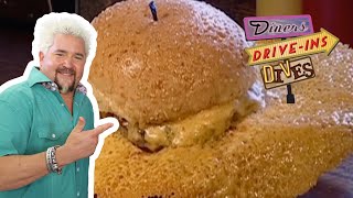 Guy Fieri Eats a Burger with a MASSIVE Cheese Skirt  Diners DriveIns and Dives  Food Network [upl. by Verneuil]