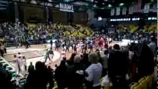 New Mexico State Player Punches Utah Valley fan after UVU fans storm the court brawl fight [upl. by Ahsekyw]