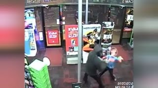 Watch Fearless 7YearOld Boy Punch Armed Robbers During Store Heist [upl. by Leahplar]