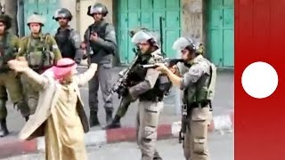 Elderly Palestinian man confronts Israeli soldiers before fainting [upl. by Sergeant]