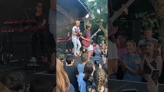 Cant believe this happened 🤯 10 year old asks band at festival to let him play guitar [upl. by Slater]