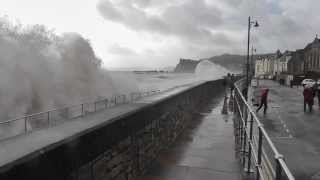 Spectator Gets Drenched As Huge Wave Breaks Over Sea Wall At Teignmouth in Devon [upl. by Cherice309]