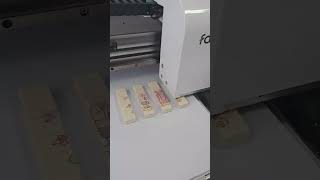 A2 Flatbed Food Printer prints on chocolate wafer cookies with sign of lovers [upl. by Newmann807]