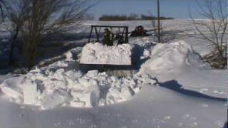 Plowing huge snow drifts with Farmall M tractor and farmhand loadermpg [upl. by Leakim]