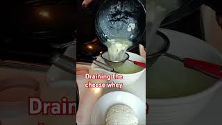 Draining the cheese whey with stainer to make cottage cheese shortsfeed [upl. by Nodgnal955]