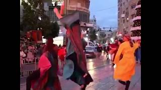 Palestinians perform dabke as the Christmas lights go up in Ramallah [upl. by Aggappora]