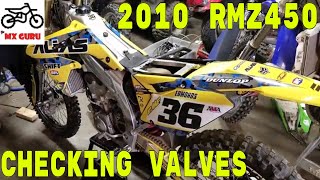 Checking the valves   Suzuki RMZ 450 2010 [upl. by Yelsgnik]