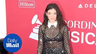 Sheer beauty Lorde in shiny translucent dress at MusiCares  Daily Mail [upl. by Samaria92]