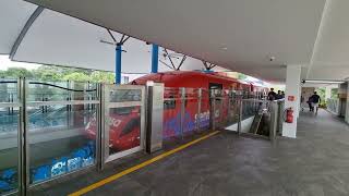 Arrival Platform Sentosa Express Hitachi Smalltype Monorail Red departing Beach station [upl. by Sucrad]