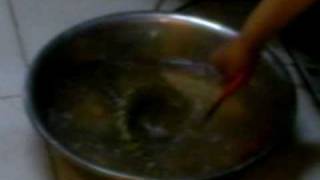 Woman tosses live Snake into boiling water [upl. by Lilaj829]