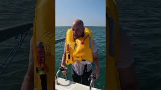 How do life jackets work when you fall overboard lifesavers lifehack boatlife [upl. by Nosretep]