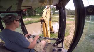 Backhoe Digging Mud [upl. by Yarezed]