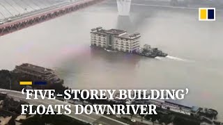 Floating restaurant drifts downriver in Chongqing China [upl. by Ardnasxela511]