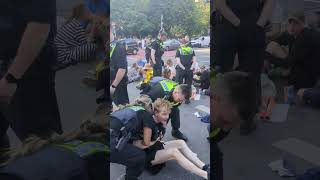 Police try to lift climate activist from road by his neck [upl. by Ailedua761]