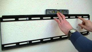 How to Mount a Large LCD LED or Plasma TV on a Wall using a Fixed TV Bracket [upl. by Gambell719]