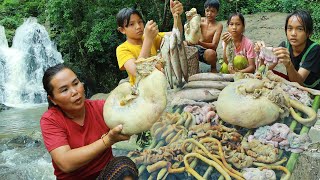 Woman cook pig intestines with fish in forest for eat [upl. by Narrad]