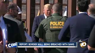 Report Border wall being breached with saws [upl. by Asilehs483]