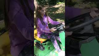 10 year old girl gets a John Deere tractor for her birthday Shes ready to bid for your lawn work [upl. by Cianca]