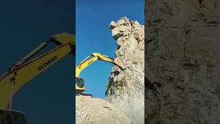 The process of crushing rock using an excavator with a jackhammer [upl. by Fauver]