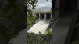 A large dam with water flowing down it [upl. by Ebbarta]