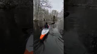 Kayaking downstream with some new fresh snow on the trees River paddle life SpringOnShorts [upl. by Chaney576]