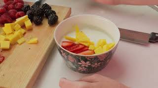 mixkit preparing a bowl with yogurt and fruit hd ready [upl. by Aryam]