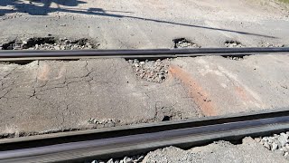 Trains Go Over Railroad Crossing Potholes From Hell [upl. by Nerraj226]