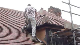 Reroofing my your house Cementing the small hip roof wwwgarecoukroof [upl. by Naryk]