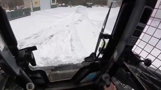 Plowing snow with our New Holland L230 skidsteer [upl. by Zoara]