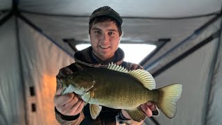 Catching SMALLMOUTH BASS Through the ICE  Rocky Lake Manitoba [upl. by Llewon395]