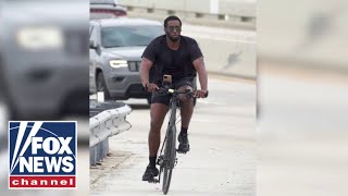 Photos show Sean Diddy Combs riding his bike in Miami days after raid [upl. by Ataliah164]