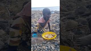 Life in the desert Turkana baby is feeding herself africa [upl. by Nonnelg]